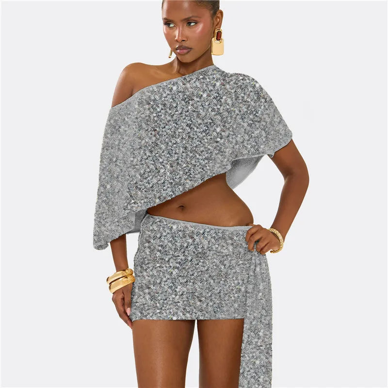 Woman wearing a gray floral off-shoulder top and skirt set on a white background