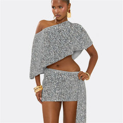 Woman wearing a gray floral off-shoulder top and skirt set on a white background