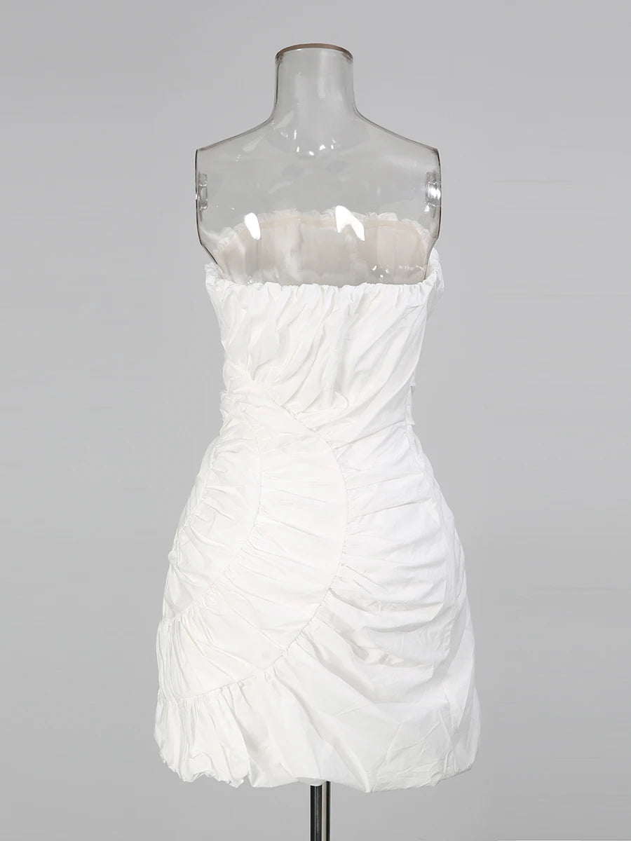 White strapless dress on a mannequin against a gray background