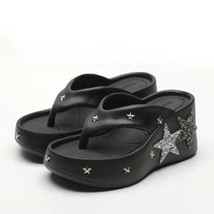 Black platform wedge heels with star embellishments