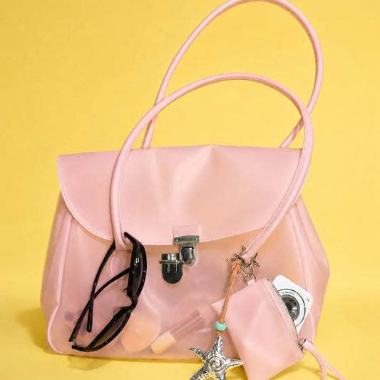 Pink transparent tote bag showing contents