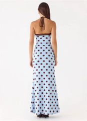 Woman wearing a polka dot dress on a white background