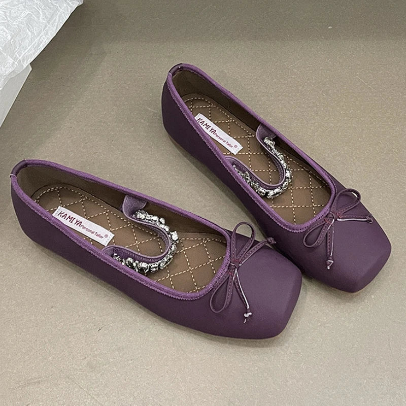 Purple square toe ballet flats with a bow and crystal embellishment