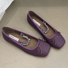 Purple square toe ballet flats with a bow and crystal embellishment