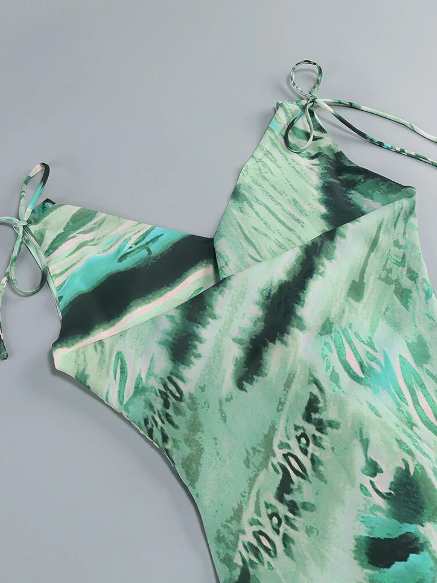 Green tie-dye swimsuit on a gray background