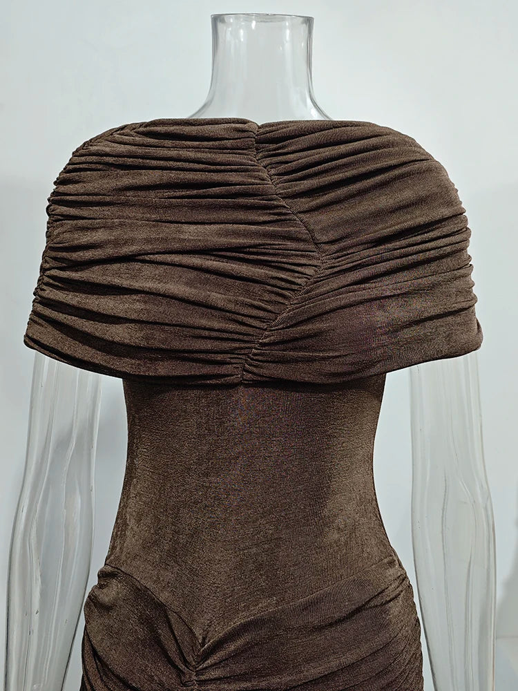 Brown pleated shrug on a mannequin against a white background