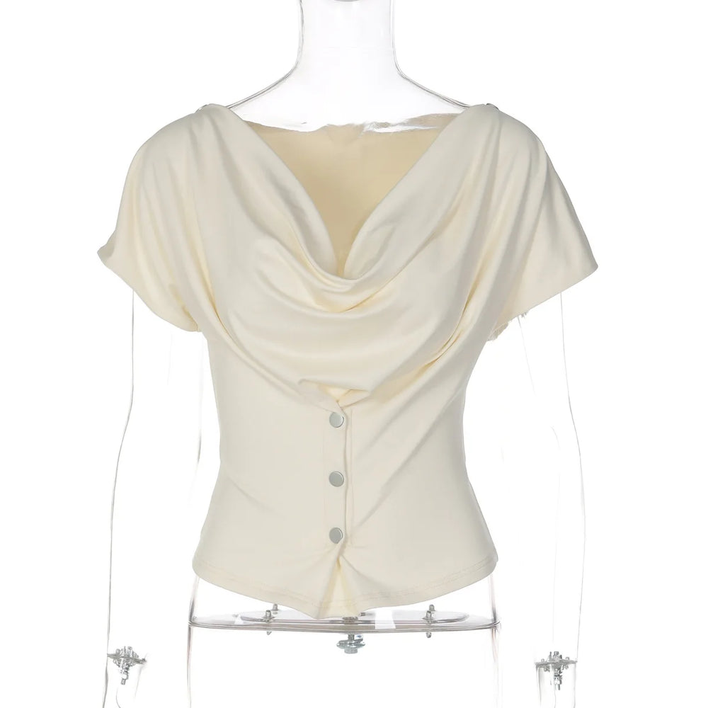 White blouse with draped design on a mannequin against a white background
