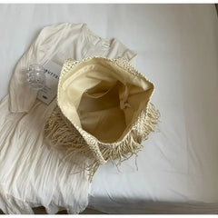 Beige hat with fringe on a white background
