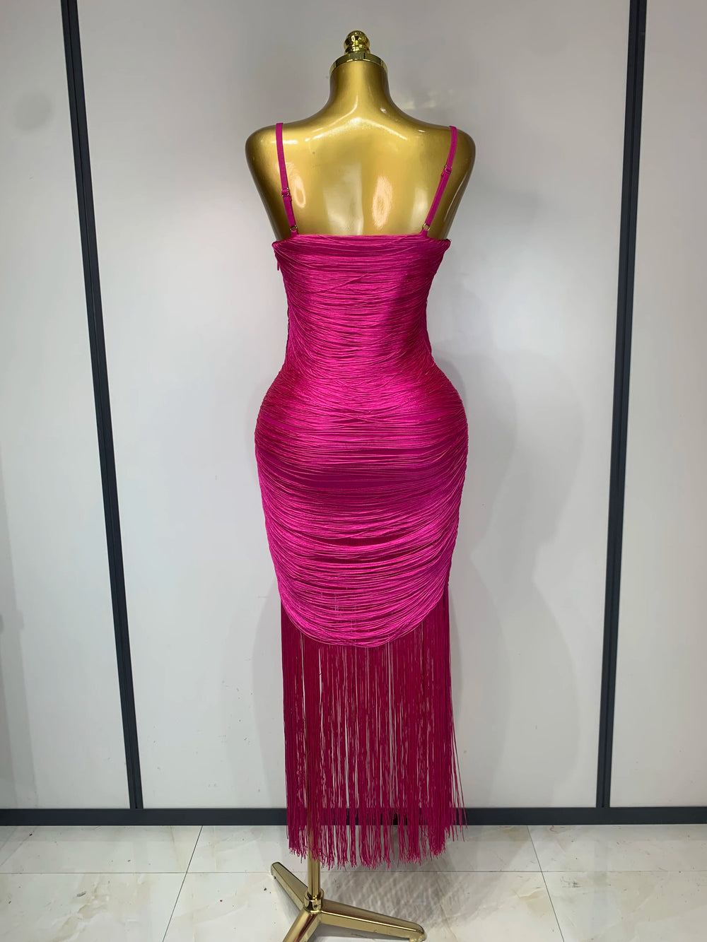 Ruched spaghetti strap tassel hem midi dress back view