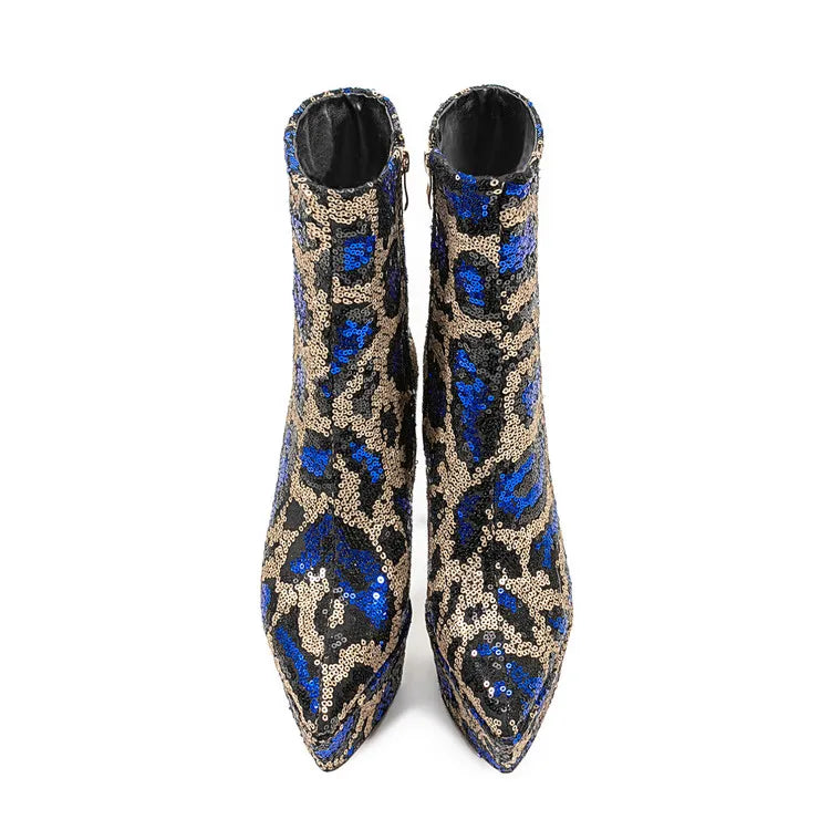 Pair of blue and gold sequin ankle boots on a white background