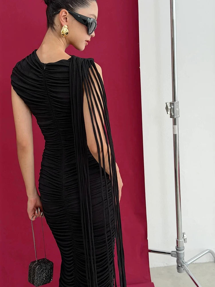 Back view of a black pleated sleeveless maxi dress