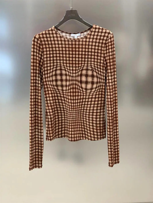 Plaid fitted long sleeve top on hanger
