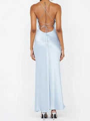 Light blue dress with criss-cross back design on a white background