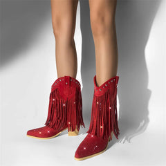 Red fringed boots with rhinestones on a neutral background