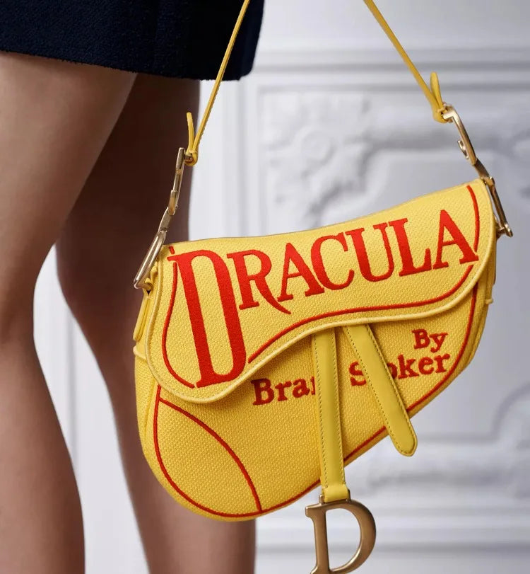 Close-up of yellow saddle bag with red 'Dracula' print detail