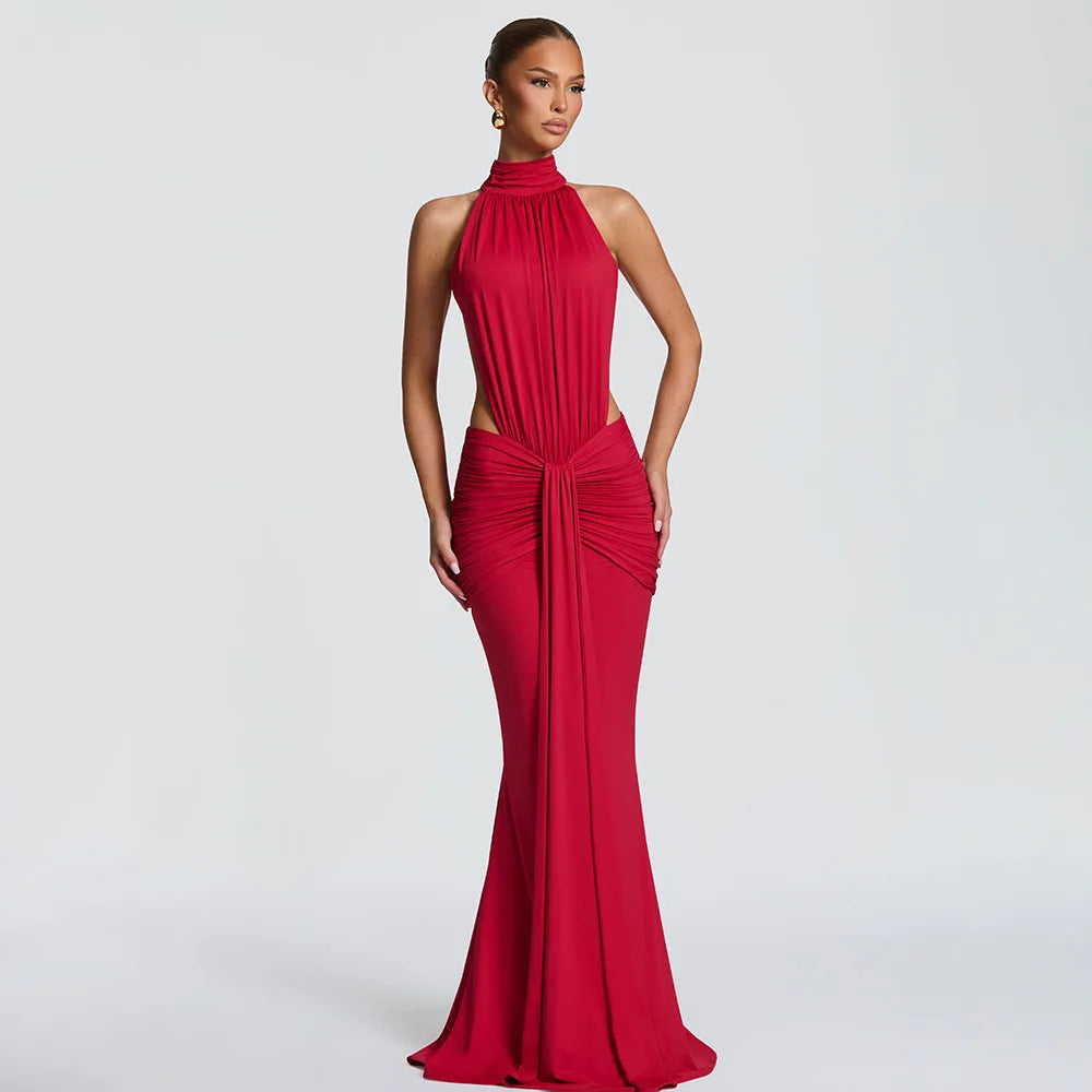 Red evening gown on a model against a plain background