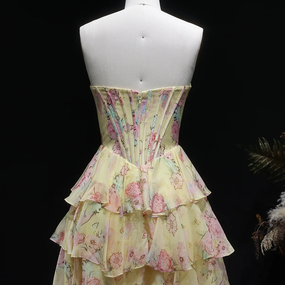 Floral tiered dress on a mannequin against a dark background