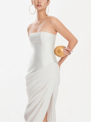 White strapless draped maxi dress with a high slit