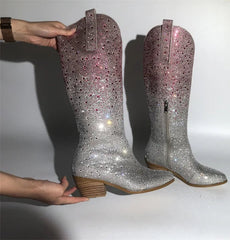 Pair of rhinestone block heel knee high boots