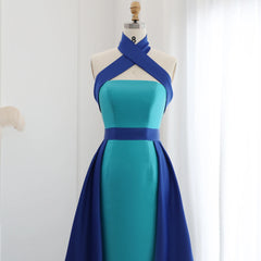  Mannequin displaying a glamorous royal blue evening gown with a contrasting turquoise overskirt and a criss-cross halter neckline. Golden Atelier 3