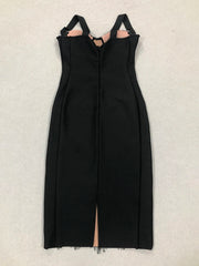 Black dress with thin straps on a light gray background