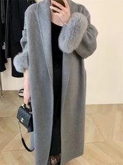 Women's winter lace-up fur lapel overcoat with long sleeves.