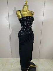 Full view of a black embellished spaghetti strap bodycon dress on a mannequin