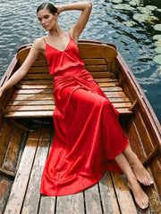 Red satin V-neck spaghetti strap maxi dress styled in a boat