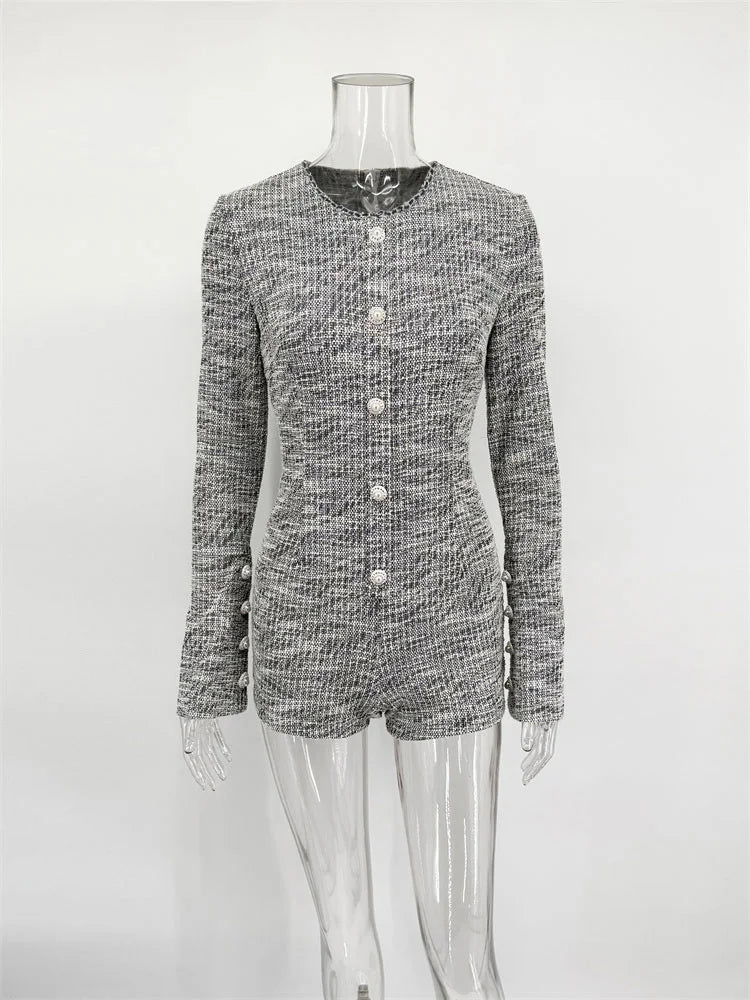 Black and white checkered blazer on a mannequin against a white background