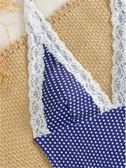 Close-up of polka dot one-piece swimwear lace detail