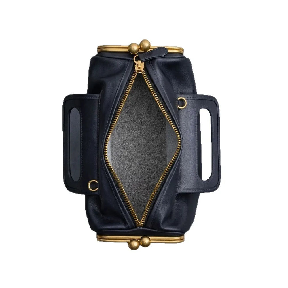 Black leather bag with gold accents on a white background