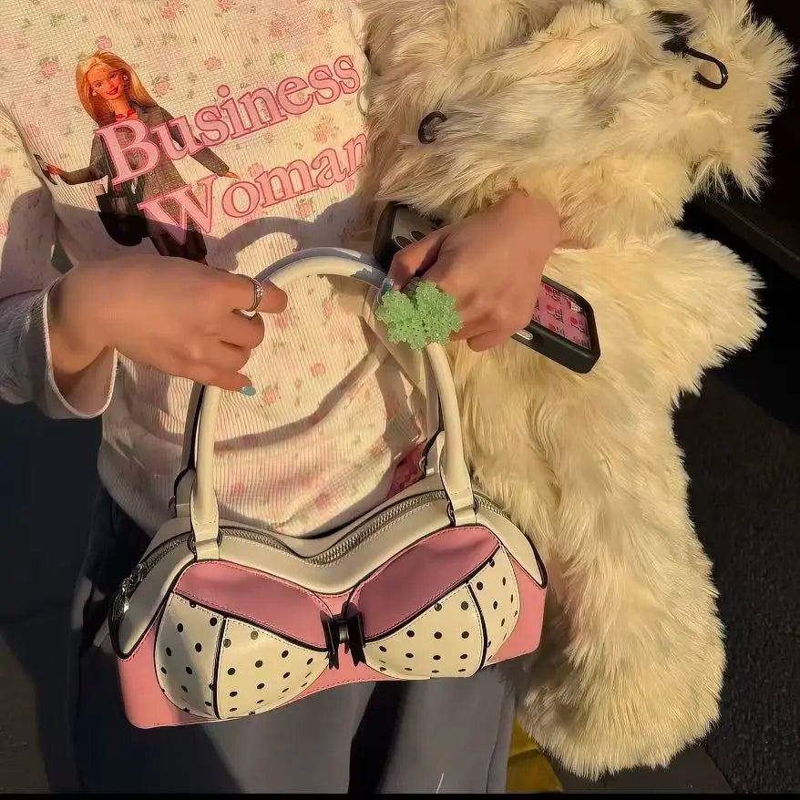 Person holding a polka dot shoulder bag