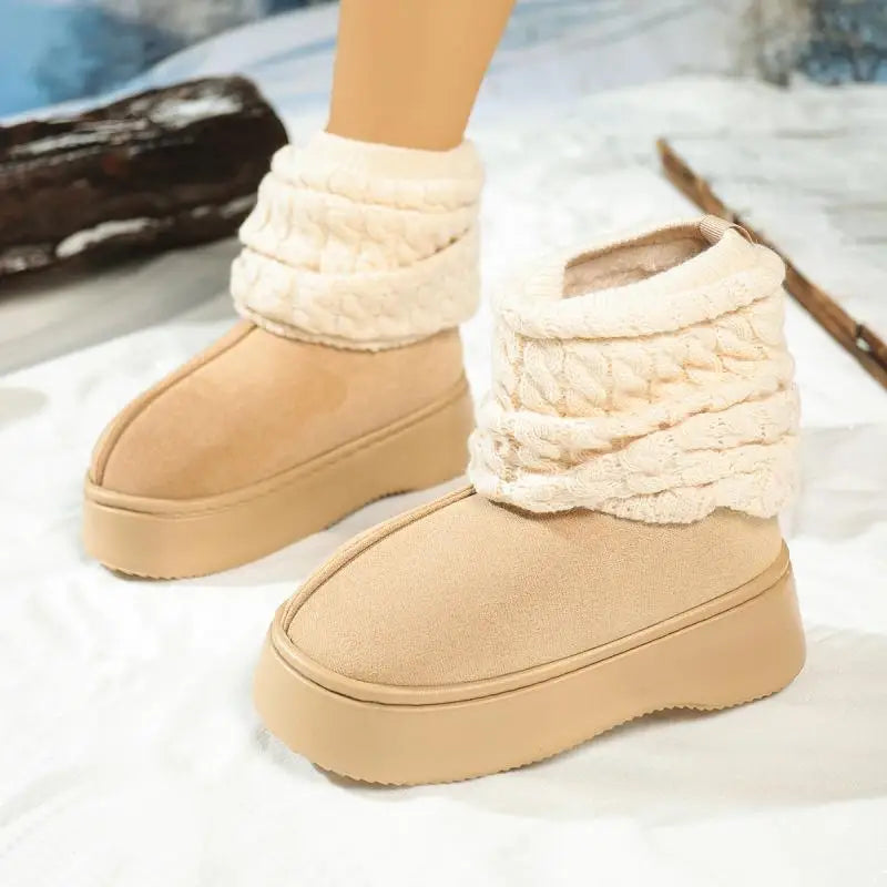 Beige winter boots with white fuzzy cuffs on a light background