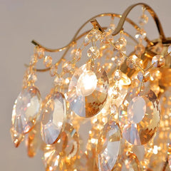 Close-up of a chandelier with crystal-like beads and gold accents.