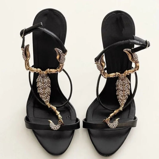 Black stiletto heel with gold scorpion embellishment and crystal details
