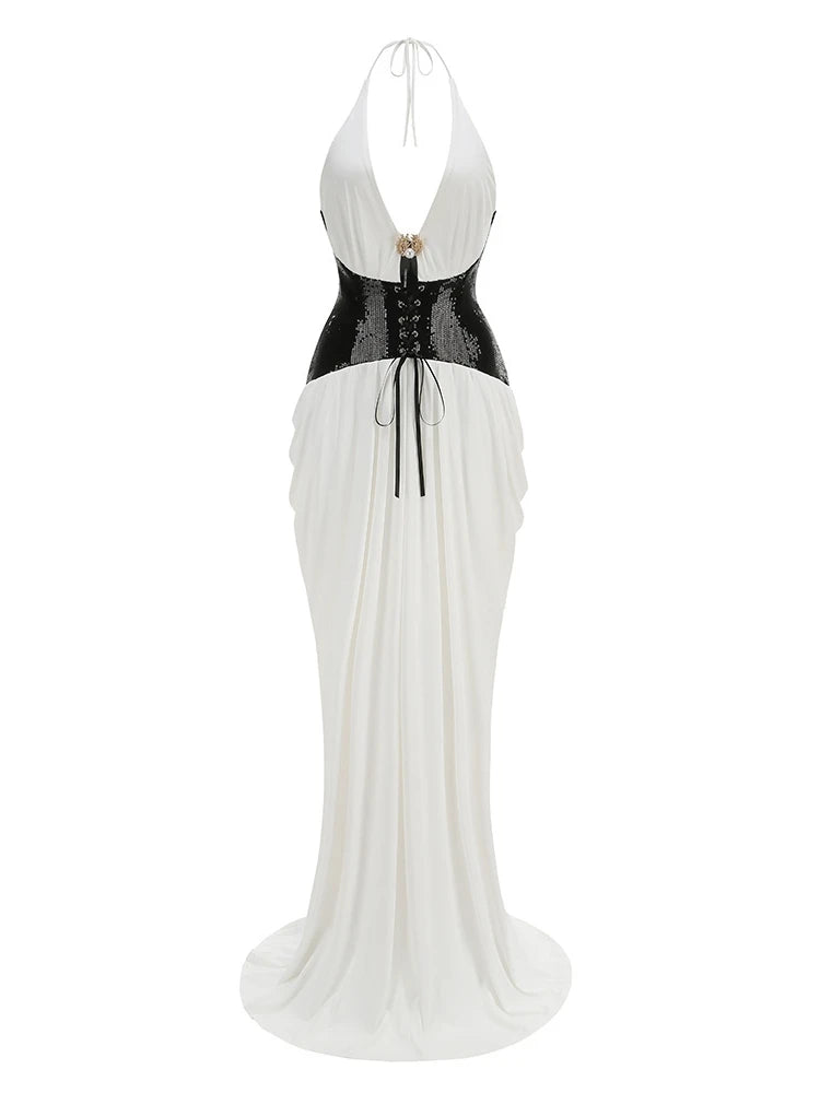 White evening gown with black corset-like waistband on a white background