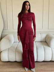 A model wearing a long sleeve, Burgundy ruched maxi dress, showcasing its elegant silhouette and draped detailing. Golden Atelier 2