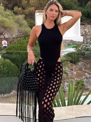 Sleeveless knit bodysuit and open knit maxi skirt with fringe detail