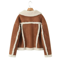 Brown jacket with white trim on a hanger against a white background
