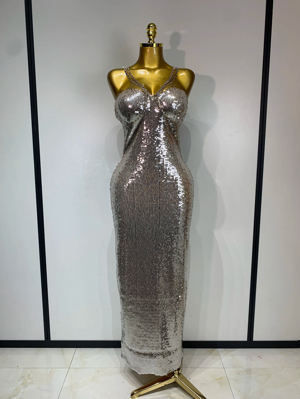 Silver glitter sequin column maxi dress with spaghetti straps.