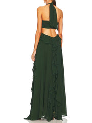 Green halter neck dress with ruffled details on a white background
