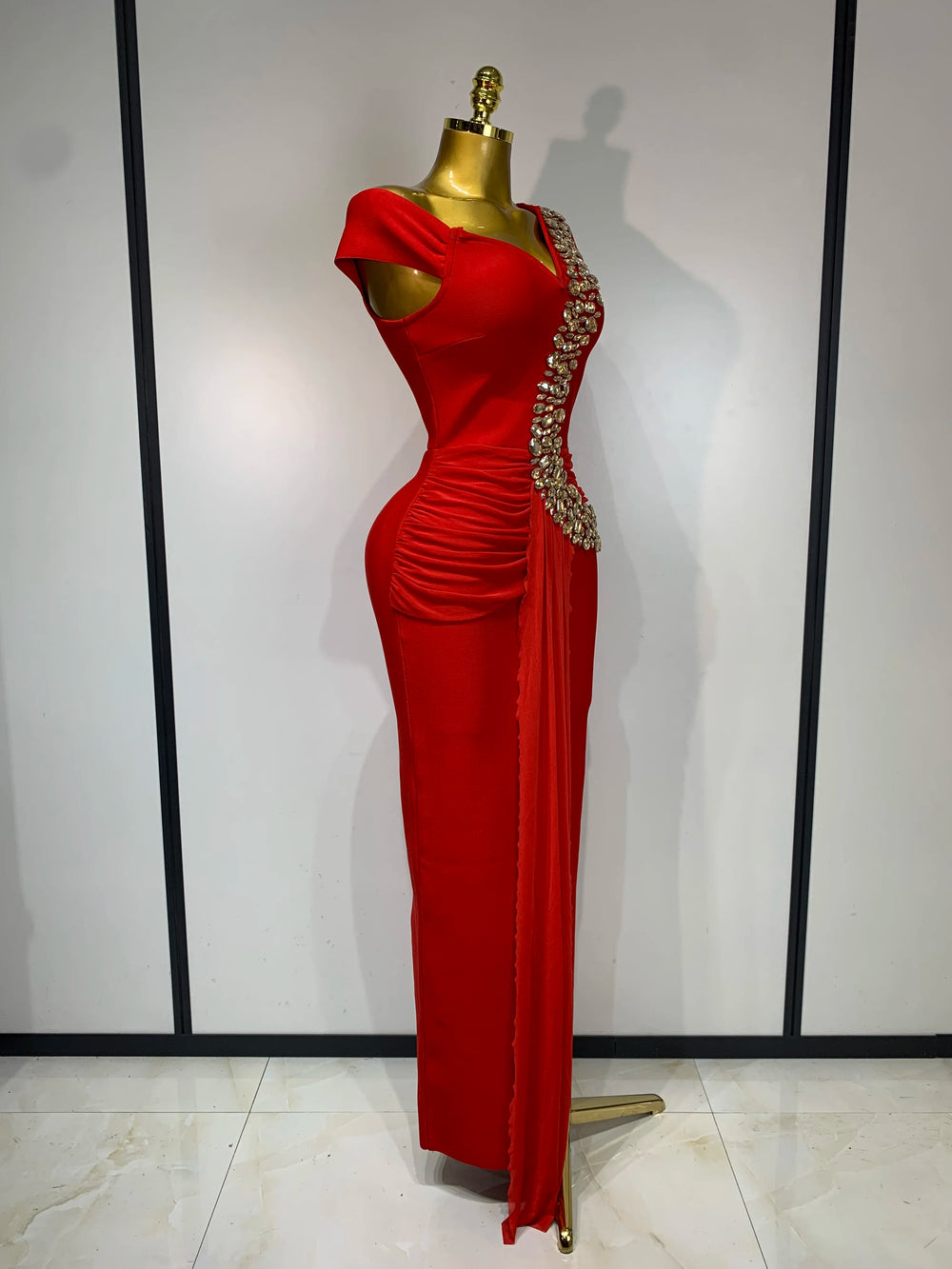 Red embellished one-shoulder dress profile view