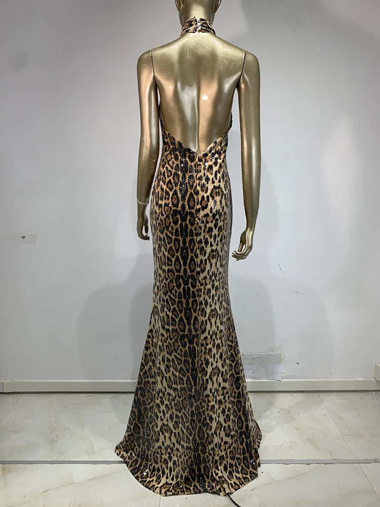 Mannequin wearing a leopard print dress against a plain background