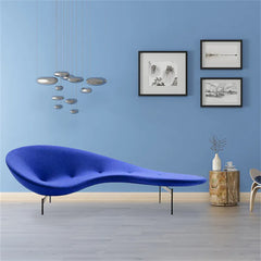 Side view of artistic pea recliner chair in gallery-style setting