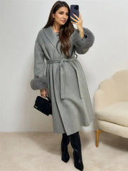 Women's winter lace-up fur lapel overcoat with long sleeves.