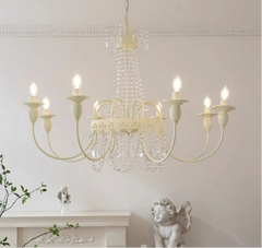 Chandelier with crystal accents on a white wall