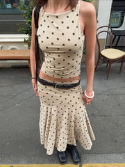 Woman wearing a polka dot dress on a street
