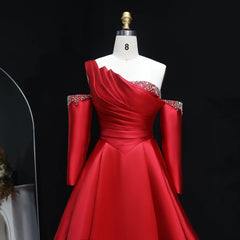 A-line court train formal women’s dress designed with sparkling embellishments  with embellishments on a mannequin against a black background