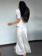The back view of the dress, showing the flowing A-line silhouette.