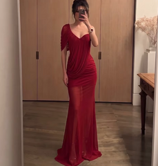 Asymmetrical neckline draped red dress with a fishtail hem